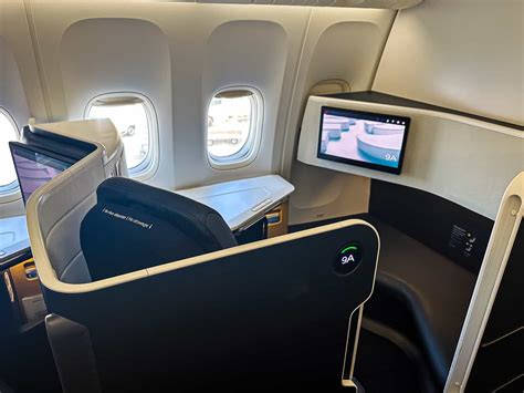 Air France business class suite sliding door elegant cabin lighting Boeing 777 interior