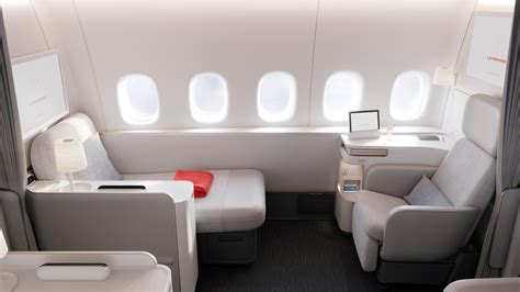 Air France La Première private suite with sofa and full flat bed