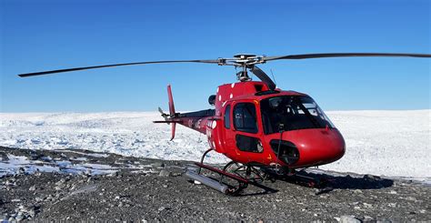 Air Greenland Airbus AS350 helicopter landing near an Arctic research camp