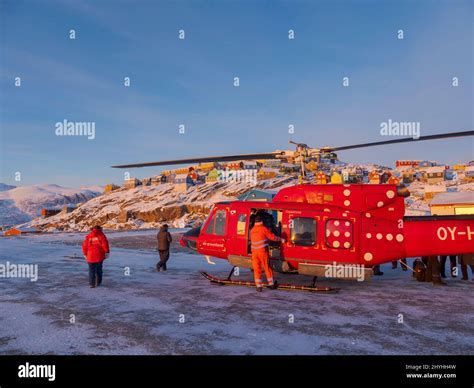 Air Greenland Bell 212 helicopter refueling near a mining site in northern Greenland