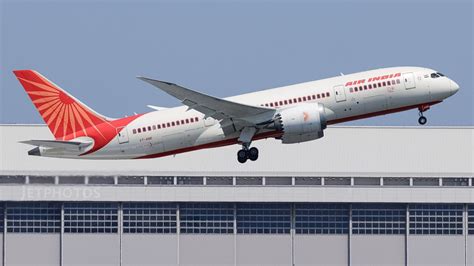 air india safety sign with grounded aircraft at mumbai airport