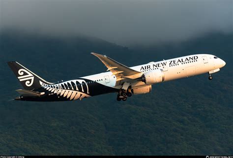 air new zealand dreamliner at hong kong international airport during sunrise