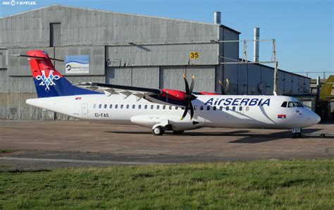 air serbia aircraft landing at mykonos airport during golden hour