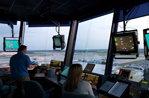 air traffic controller monitoring dense flight traffic at Atlanta airport tower