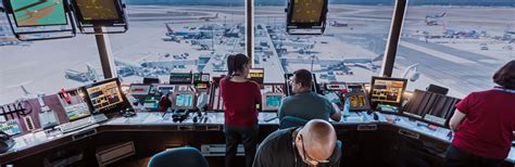 Air traffic controllers monitoring real-time rerouting at Dubai International Airport control tower
