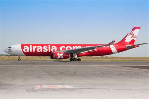 AirAsia X Airbus A330 long-haul aircraft at Kuala Lumpur International Airport preparing for London flight