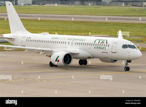 Airbus A220-300 taxiing before departure at busy airport