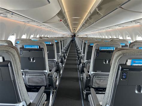 Airbus A220 cabin interior showcasing wide seats and large windows