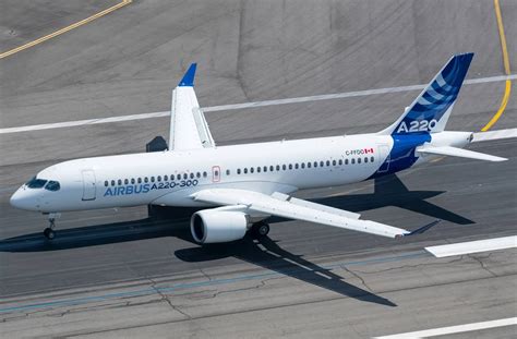 Airbus A220 passenger aircraft taking off from modern airport runway