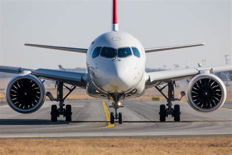 Airbus A220 wing and PW1500G geared turbofan engine during cruise flight