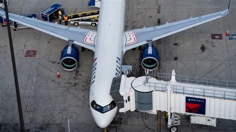 Airbus A321neo parked at busy U.S. airline hub airport gate