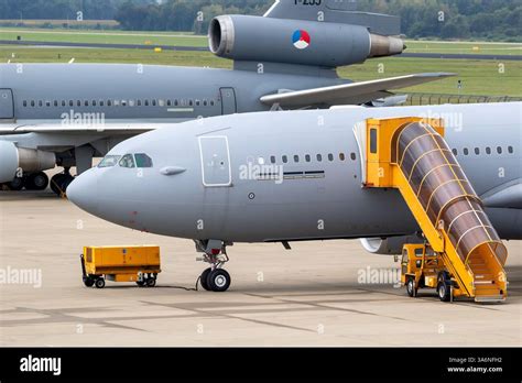 airbus a330 mrtt refueling a fighter jet mid-air