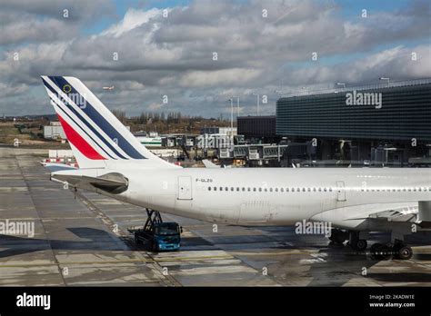 Airbus A330 with canted winglets preparing for departure at Paris Charles de Gaulle Airport