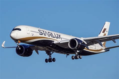 Airbus A350-900 widebody aircraft flying over clouds during long haul service