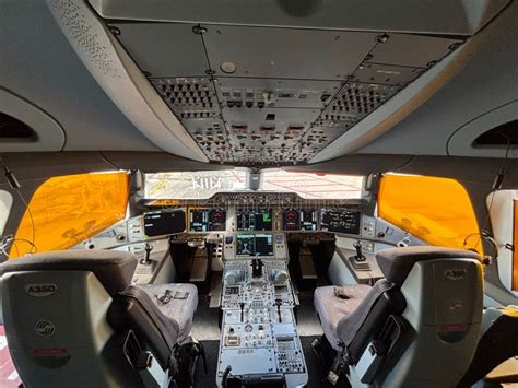 Airbus A350 cockpit during cruise flight above weather systems