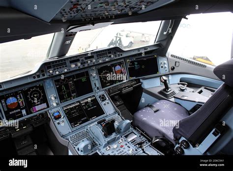 Airbus A350 cockpit instruments during international flight night sky