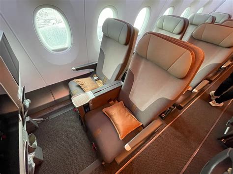 Airbus A350 premium economy cabin with modern wide seats on long haul flight