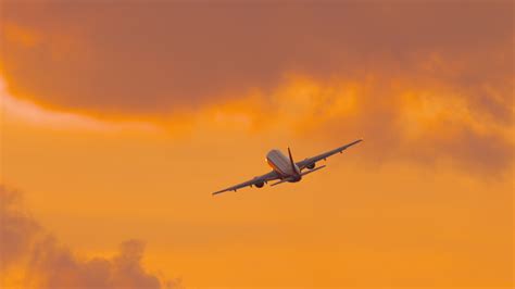 Airbus A350 taking off at sunset with low noise modern engines