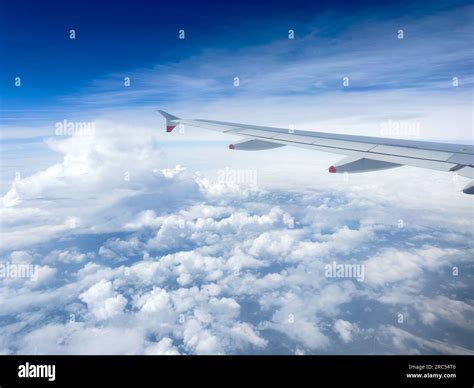 Airbus A350 wing flexing during cruise flight above clouds