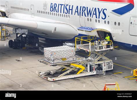 airbus a380 loaded with fuel trucks and service vehicles at night