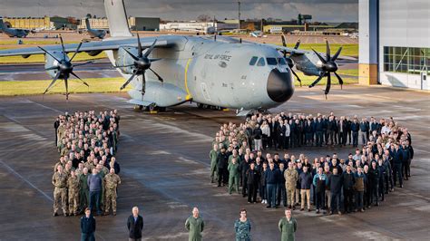airbus a400m loading military vehicles on active runway