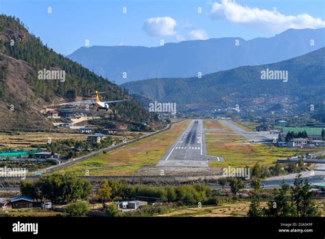 Aircraft approaching Paro Airport through Bhutan Himalayan valley