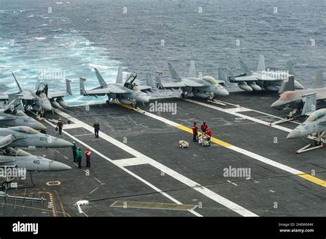 aircraft carrier flight deck operations with F-35C and F/A-18 jets