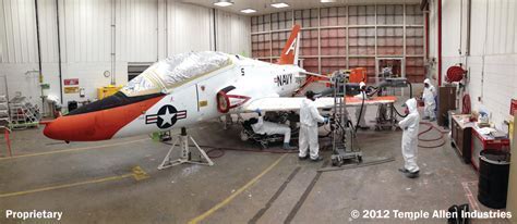 aircraft in sanding and stripping phase inside hangar in Arkansas