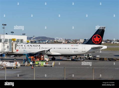 aircraft taxiing under stormy skies at Montreal-Trudeau Airport