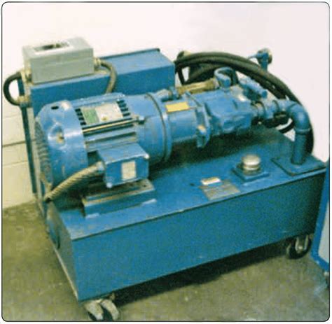 aircraft technician operating portable hydraulic power unit on tarmac