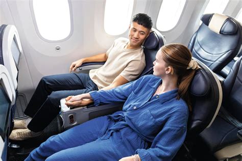 airline gate agent processing business class upgrade passengers