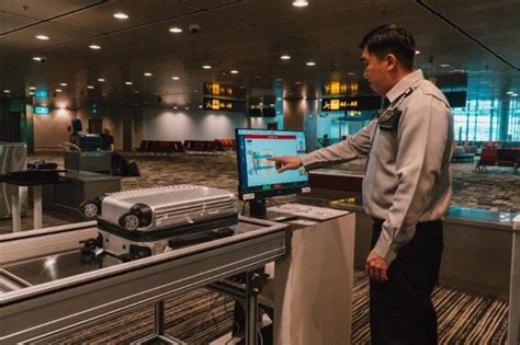 airline gate AI carry-on scanner detecting oversized luggage