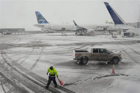 airline ground crews coordinating recovery operations after mass cancellations during storm disruptions