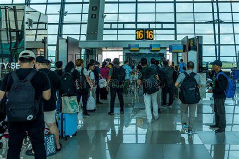 airline passengers waiting at airport gate standby list display
