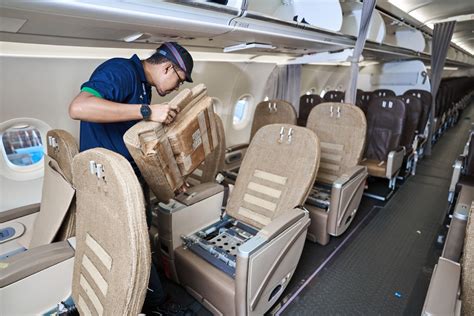airline technicians installing aircraft seats during cabin refurbishment