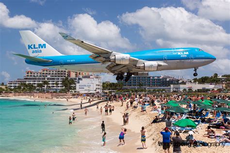 Airliner flying low above Maho Beach in Sint Maarten