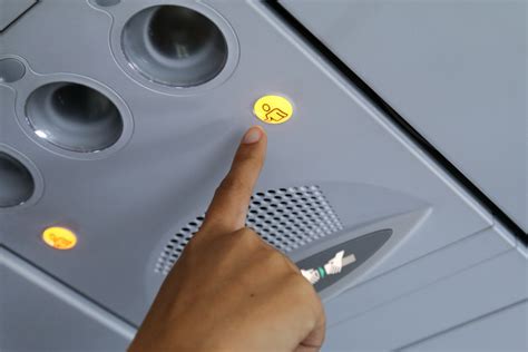 airplane passenger pressing call button repeatedly during flight service