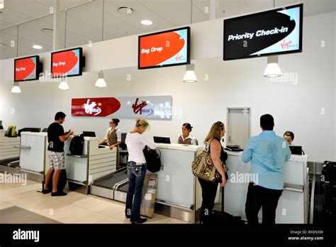 Airport check-in counter for La Compagnie with passengers waiting
