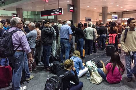 airport gate overbooked flight announcement with waiting passengers