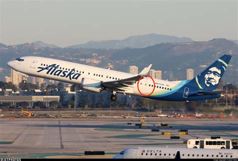 Alaska Airlines Boeing 737-900 parked at airport during retirement era
