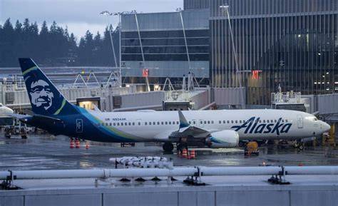 Alaska Airlines Boeing 737 parked at Seattle-Tacoma International Airport gates