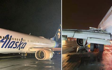 Alaska Airlines jet undergoing maintenance after emergency pressurization incident at Seattle base