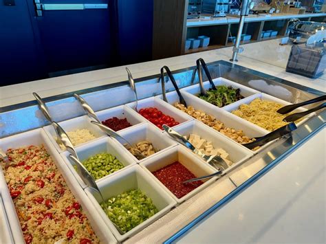 Alaska Airlines lounge at SFO with modern seating and self-serve food area