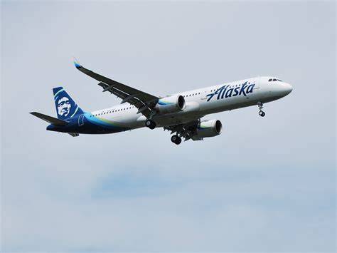 Alaska Airlines operations control center with aircraft schedules displayed