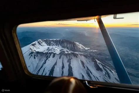 Alaska Airlines plane flying over Pacific Northwest mountains near Vancouver route