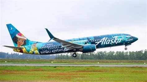 alaska airlines plane parked at seattle gate