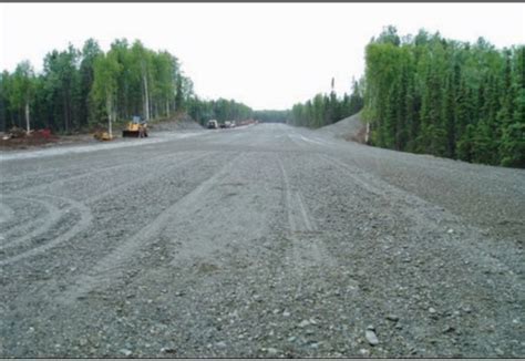 Alaska DOT maintenance crew inspecting gravel runway at Pilot Point Airport