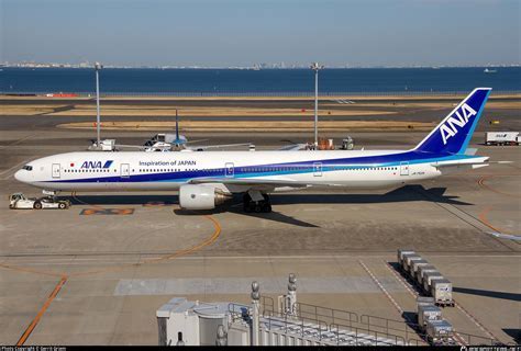 all nippon airways boeing 777-200 touching down in tokyo haneda during cloudy weather