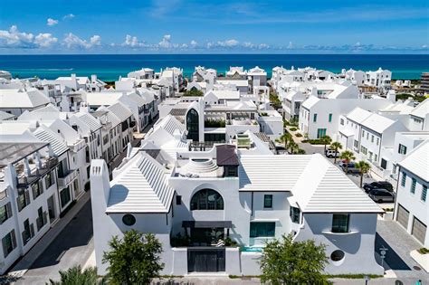 Alys Beach whitewashed architecture with colorful digital graffiti art installation at night