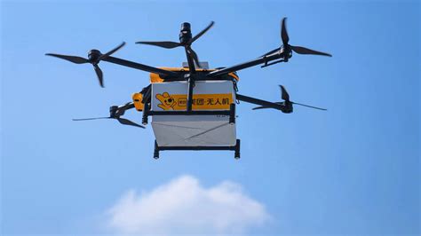 amazon technician programming drone delivery zone on tablet